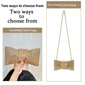 Golden bow clutch bag with rhinestones, usable as a handheld or cross-body purse