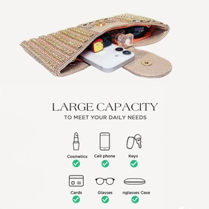 Detailed interior of glitter evening clutch showing capacity for phone and cosmetics