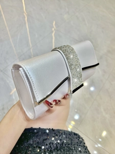 Elegant white satin evening clutch bag with sparkling rhinestone band for wedding party