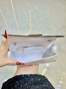 Silver evening clutch bag with rhinestone buckle and chain strap for gala events