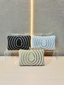Elegant vintage evening clutch bags with pearls and rhinestones in black, white, and gold
