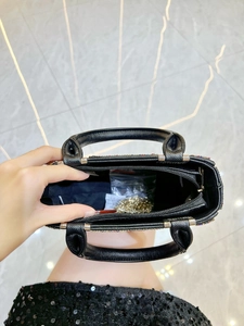 Crossbody black Saffiano handbag with diamond-studded finish and silver chain strap