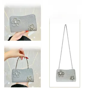 Silver glitter evening clutch showing three ways to carry with chain and top handle