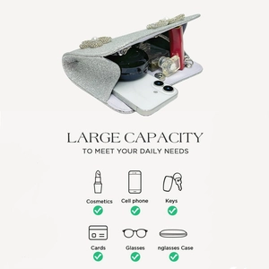 Interior view of silver evening clutch showing capacity for phone and cosmetics