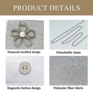 Close-up of silver glitter clutch bag with pearl flower detail and metal chain strap
