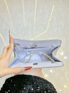 Silver glitter evening clutch bag with blue satin lining and silver chain strap