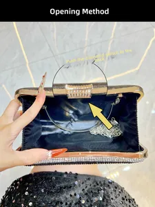 Detail of black rhinestone evening clutch with diamond clasp and silver chain strap