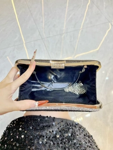 Elegant black rhinestone evening clutch bag with gold frame and detachable chain strap