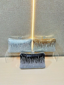 Elegant rhinestone evening clutches in silver gold and black with shimmering sequin lines