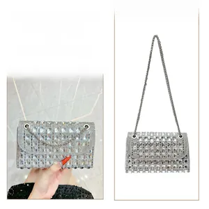 Detailed view of silver crystal clutch bag showing clutch and crossbody styles with chain