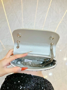 Sparkling silver rhinestone evening clutch bag with metal chain strap and flap closure