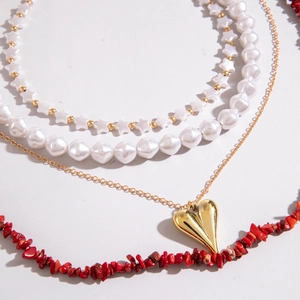 Bohemian multilayer necklace set with pearls, gold heart pendant and red stone beads