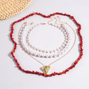 Bohemian multilayer necklace set with red stone heart, pearls, and star charms