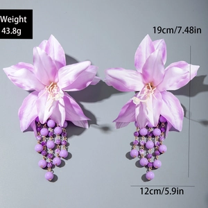 Detail view of purple fabric flower earrings with long beaded tassels and size dimensions
