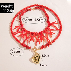 Detailed view of layered red acrylic stone necklace with a golden heart pendant and measurements