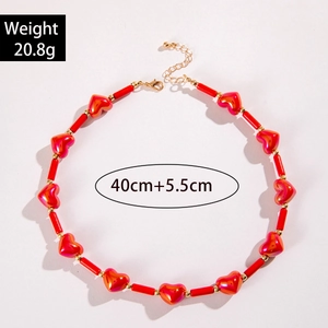 Detail of red acrylic heart and bead necklace with 40+5.5cm adjustable gold chain