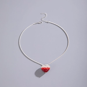 Detail of red and white pave crystal heart pendant with silver lobster clasp and chain