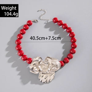 Statement necklace with bold red acrylic beads and a silver floral pendant for women
