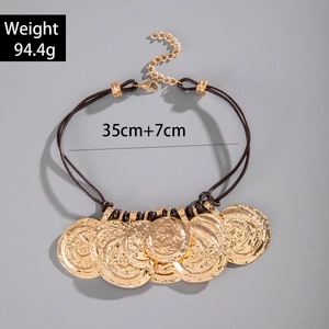 Detail of vintage necklace featuring golden coin pendants with textured finish and sizing specs