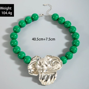 Detail of green acrylic beads and silver floral pendant with size and weight specs