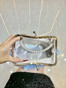 Light blue lace evening handbag with rhinestones, pearl handle and silver chain strap