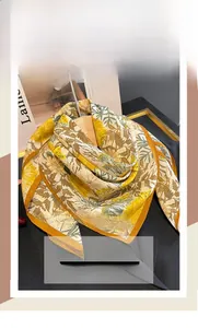 Detail of soft silk-cotton blend scarf with yellow floral print and elegant folds
