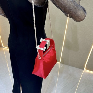 Elegant red satin clutch with rhinestone handle and silver chain strap for parties
