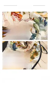 Close-up of large floral print silk scarf with fine stitching and black contrast border