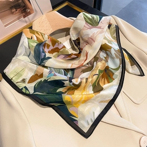 Floral print satin neck scarf for women styled on a beige blazer with elegant botanicals