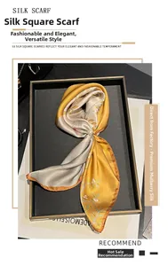 Detail of silk square scarf with floral pattern and pearl ring buckle on display