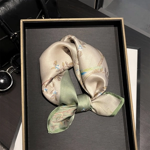 Vintage champagne and green silk square scarf with floral bird print on wooden tray