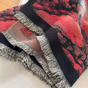 Winter faux cashmere scarf with red and black abstract cloud pattern and fringe