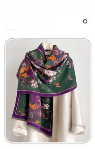 Detail of imitation cashmere scarf with vintage floral patterns and fine tassels