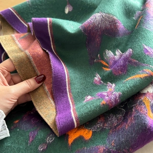 Deep green cashmere feel shawl with purple abstract floral patterns and tassel edges