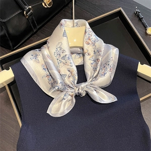 Elegant 53cm silk scarf with silver floral butterfly print paired with navy knit top