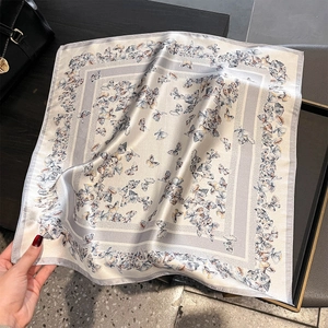 53cm square silk scarf featuring a grey butterfly print with a premium satin finish