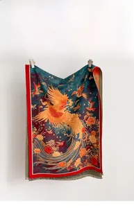 Macro detail of high-density scarf fabric with phoenix floral pattern and fringed edges