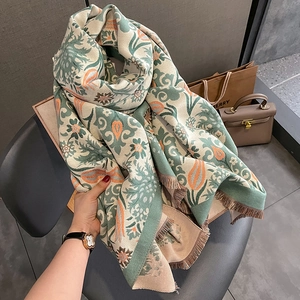 Detail of vintage bohemian floral scarf with soft tassels and thick jacquard texture