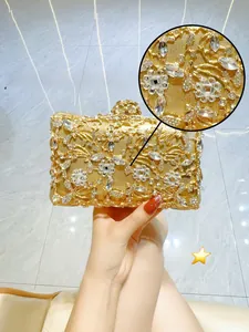 Detail of luxury gold evening clutch bag with 5A grade rhinestones and floral texture