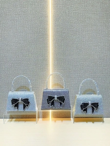 Luxe square evening clutch bags with sparkling rhinestones and oversized black bows