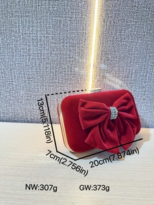 Red velvet evening clutch bag with large rhinestone bow and gold metal frame