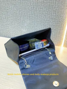 Interior view showing the large capacity of this sparkly bow evening clutch bag