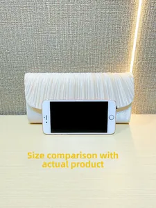White pleated satin evening clutch bag size comparison with a mobile phone reference