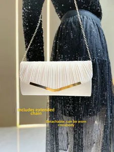 Champagne satin evening clutch with gold V-metal frame and detachable chain strap
