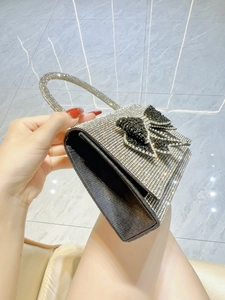 Sparkling silver rhinestone square handbag with a black crystal bow for evening party