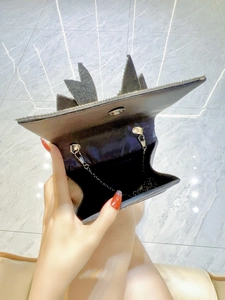 Elegant rectangular clutch bag with crown design, rhinestone edges and chain strap