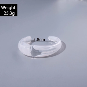Detail view of acrylic open bangle showing 5.8cm inner diameter and 25.3g weight