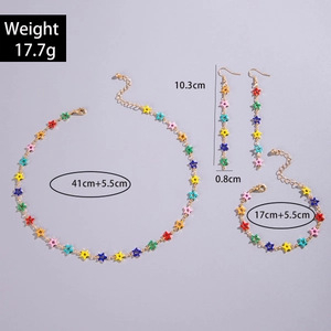 Detail of colorful star charm jewelry set including necklace and tassel earrings