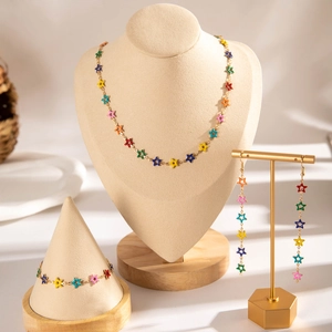 Detailed display of colorful star-shaped jewelry set with necklace, bracelet and earrings