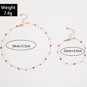 Detailed size chart for gold devil eye tassel necklace and heart bracelet set with 7.4g weight